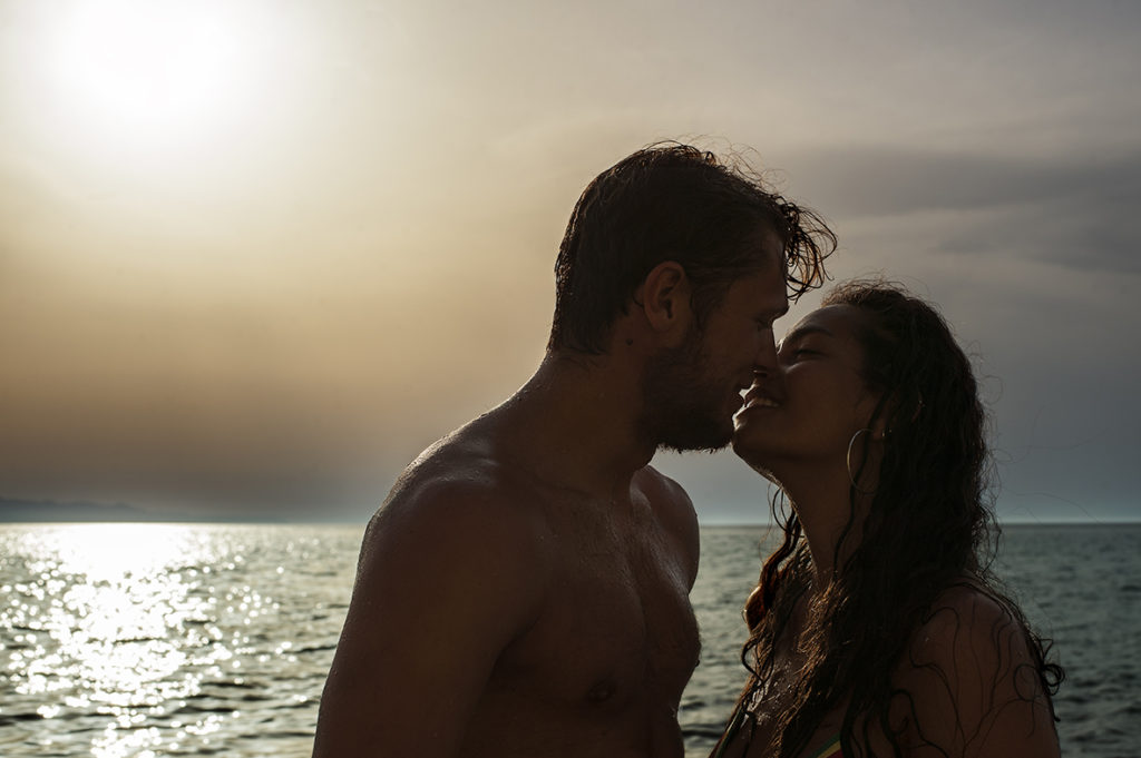 Greece Destination Engagement - Corfu - kiss with sunset background on the beach