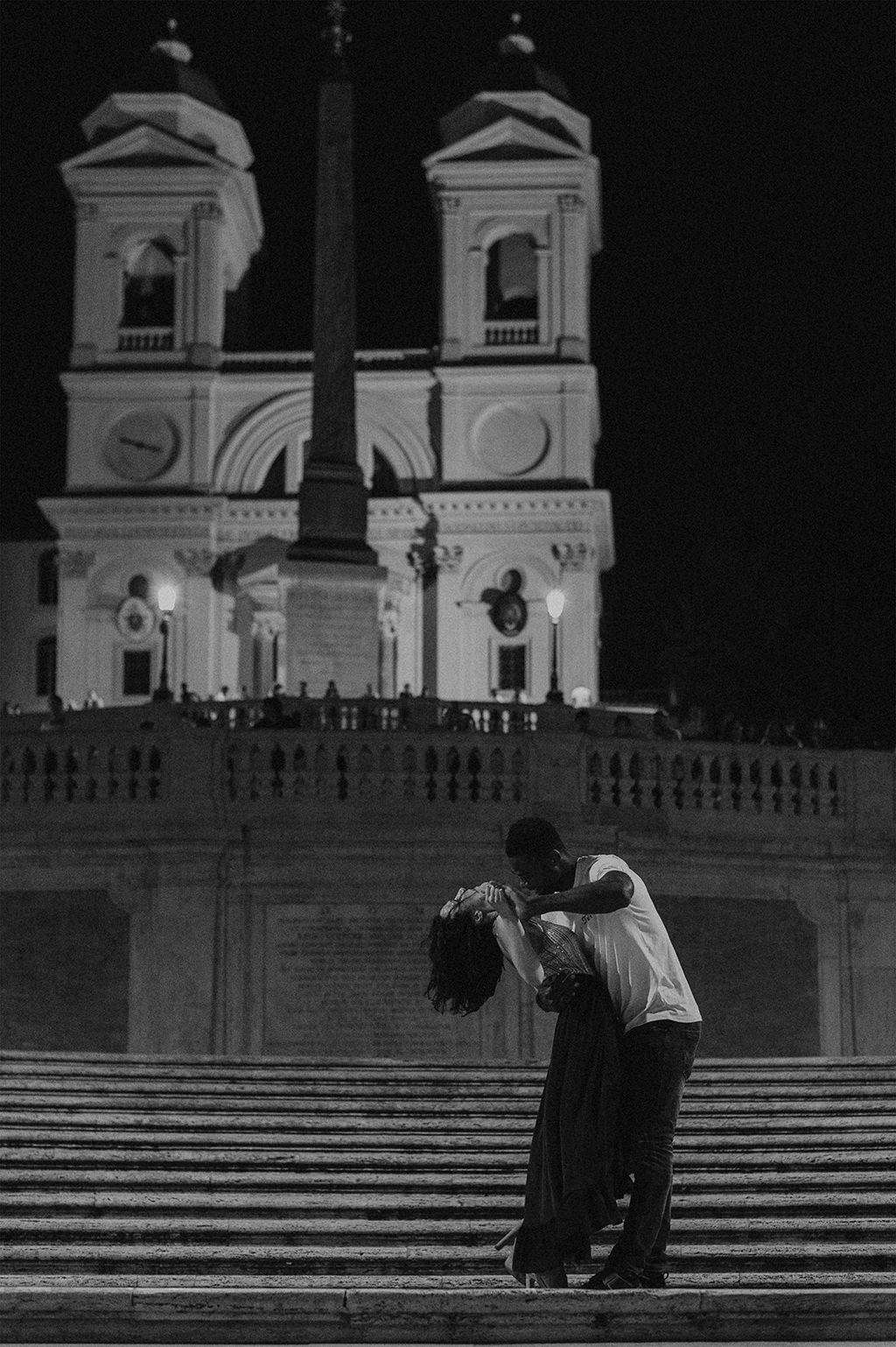 Interracial couple dancing in Piazza di Spagna steps, Rome