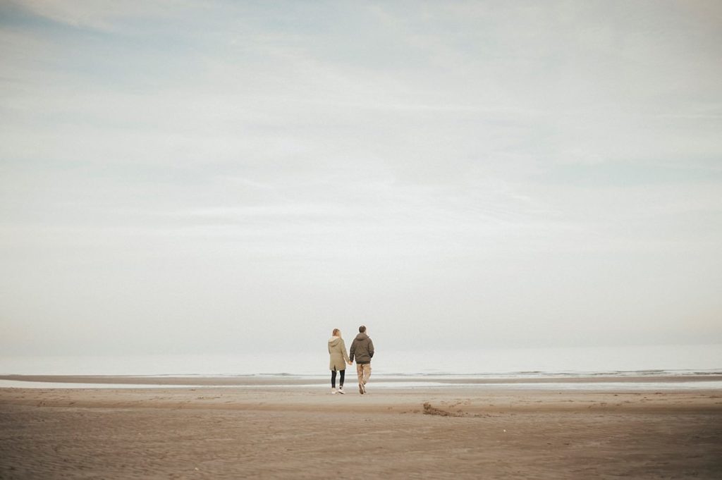 sea landscape with couple walking